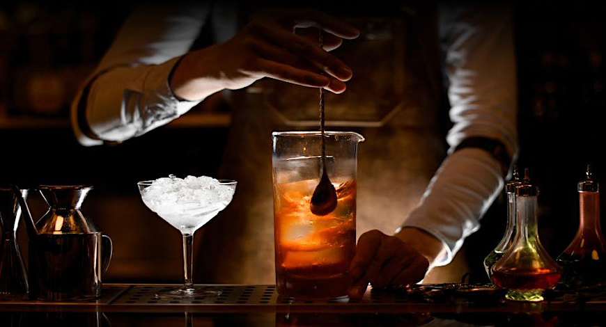 Photo of bartender mixing a cocktail