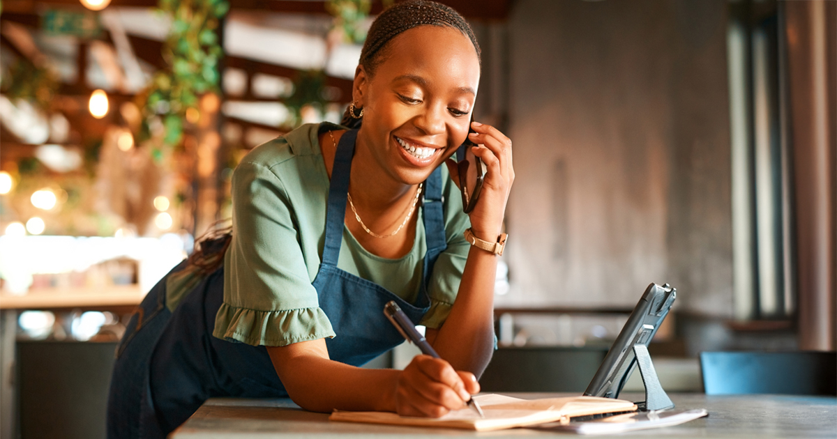Woman employee writing a sales order