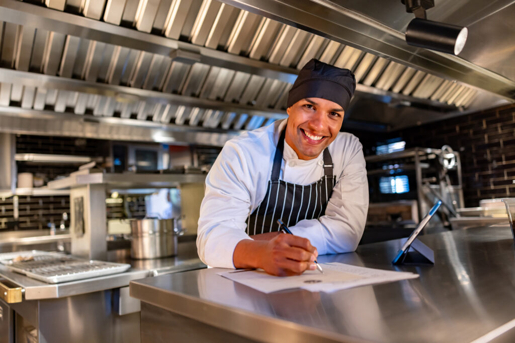 Restaurant owner smiling at camera