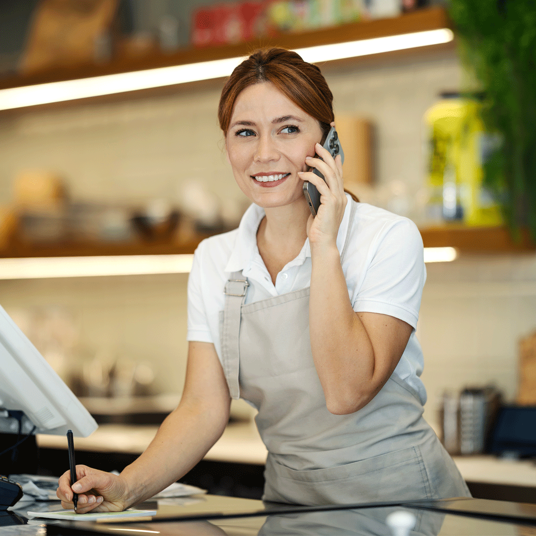 Square POS Apps Featured Image - Woman smiling at POS system